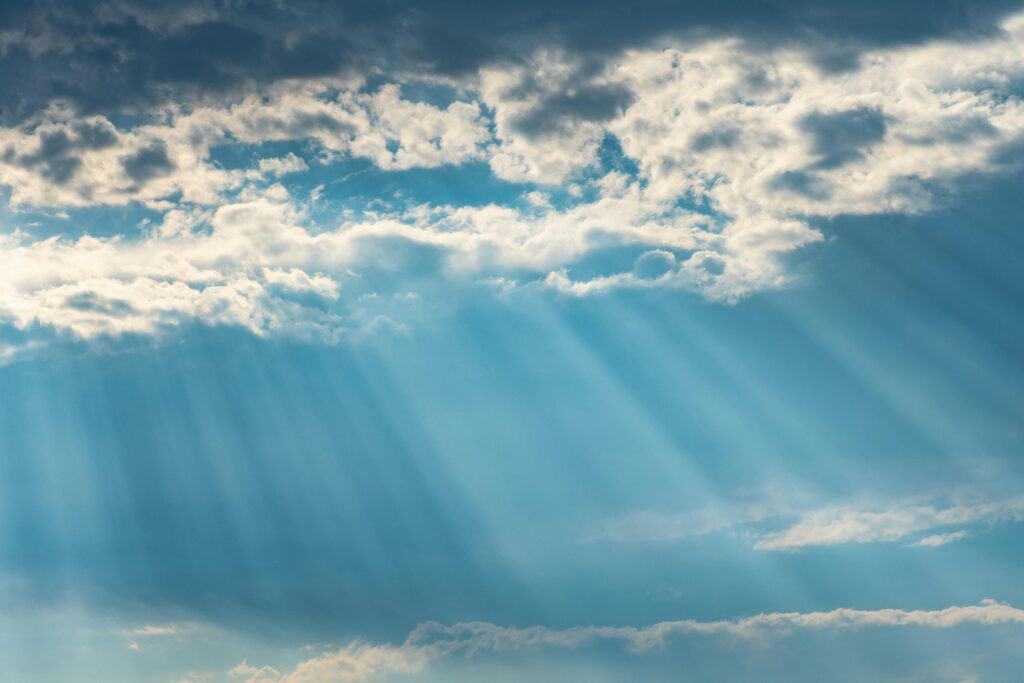 Sunlight streaming through clouds.